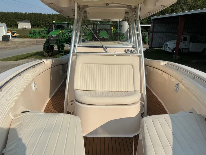 H Lady Frances Yacht Photos Pics 2011 Grady-White Canyon 336 boat interior with beige seating and wood flooring.