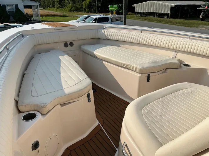 H Lady Frances Yacht Photos Pics 2011 Grady-White Canyon 336 boat interior with cushioned seating and wood flooring.