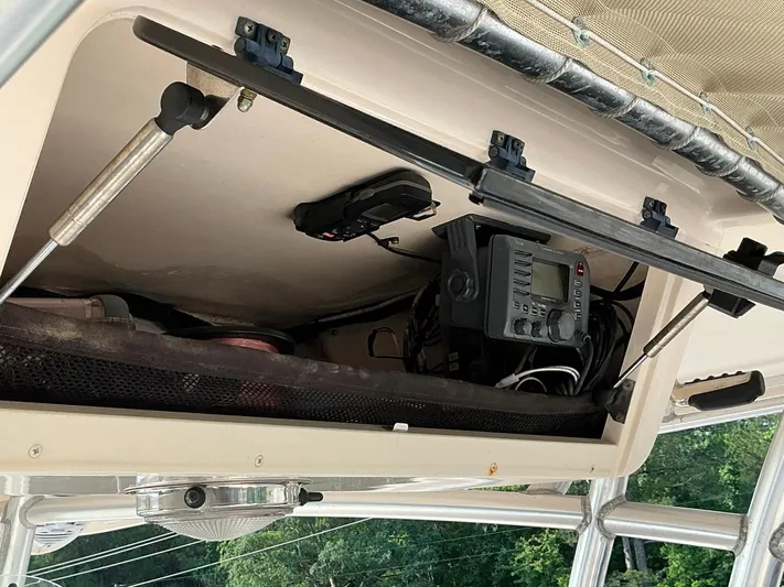 H Lady Frances Yacht Photos Pics 2011 Grady-White Canyon 336 boat storage compartment with electronic equipment and wiring.