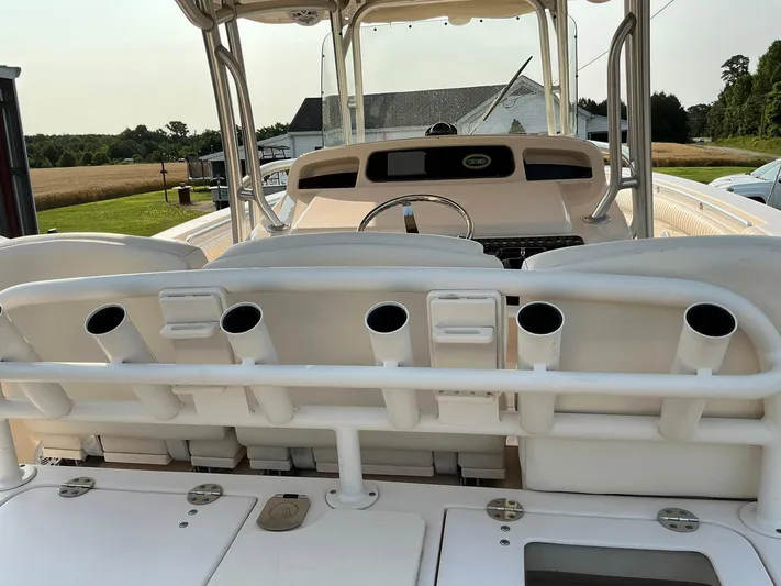 H Lady Frances Yacht Photos Pics 2011 Grady-White Canyon 336 boat interior with rod holders and steering console.