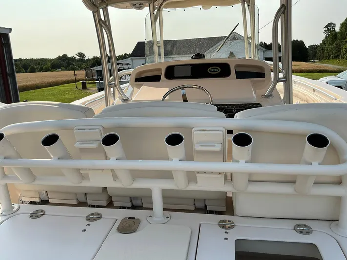 H Lady Frances Yacht Photos Pics 2011 Grady-White Canyon 336 boat interior with rod holders and helm station.