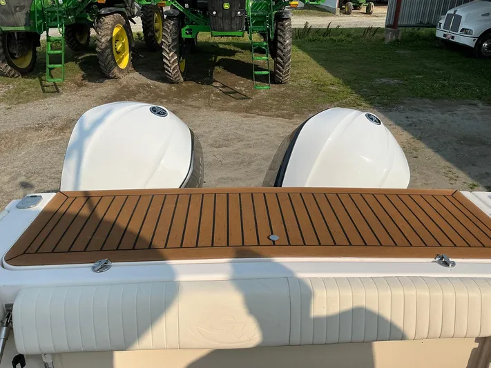 H Lady Frances Yacht Photos Pics 2011 Grady-White Canyon 336 boat with dual engines and wooden deck, parked near tractors.