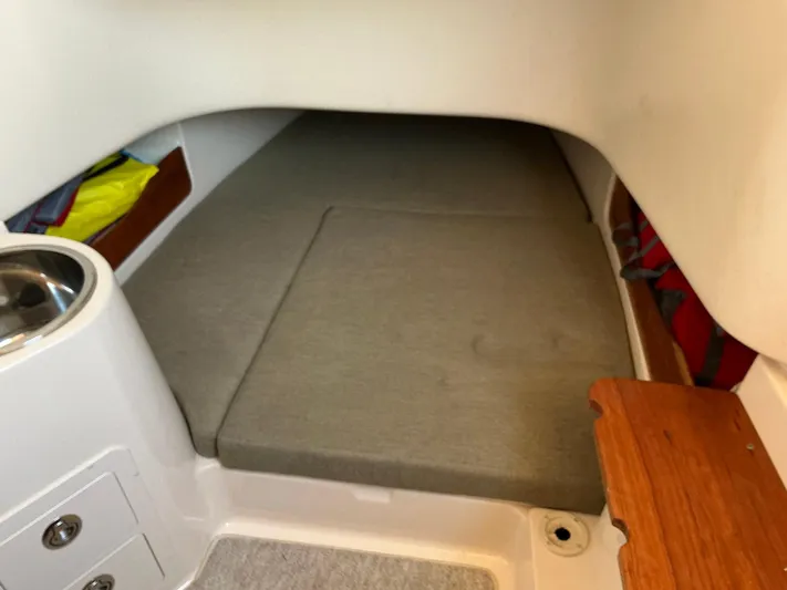 H Lady Frances Yacht Photos Pics 2011 Grady-White Canyon 336 cabin interior with cushioned sleeping area.