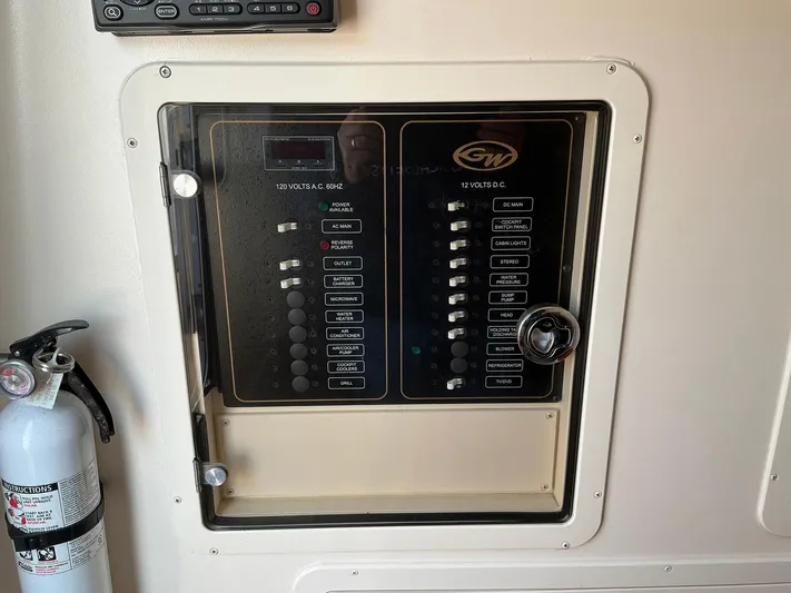 H Lady Frances Yacht Photos Pics Control panel of a 2011 Grady-White Canyon 336 boat with fire extinguisher nearby.