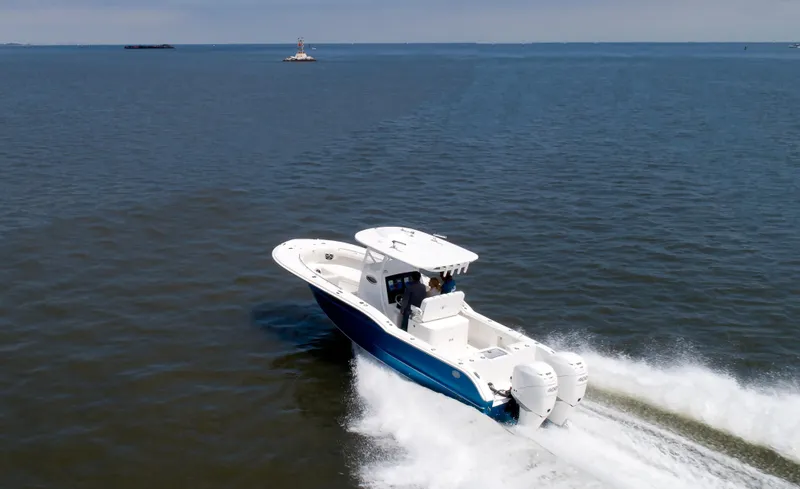  Yacht Photos Pics 2025 Buddy Davis 28 Center Console boat cruising on open water.