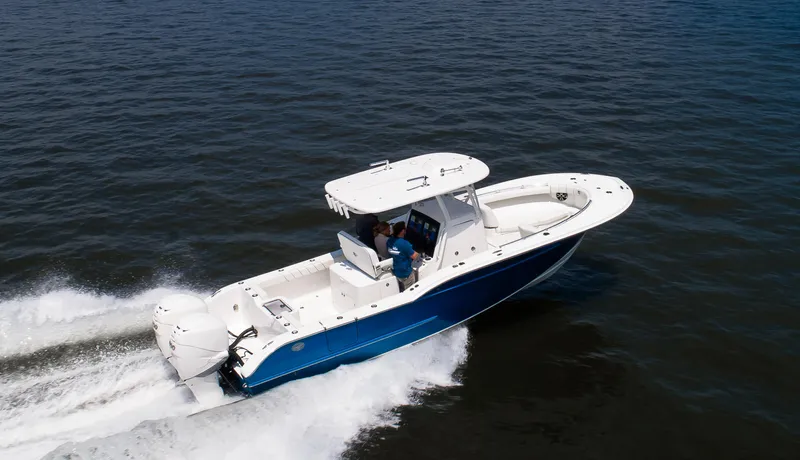  Yacht Photos Pics 2025 Buddy Davis 28 Center Console boat cruising on open water.