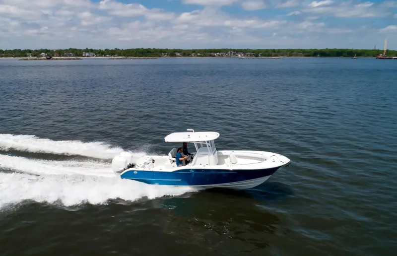  Yacht Photos Pics 2025 Buddy Davis 28 Center Console boat cruising on open water.