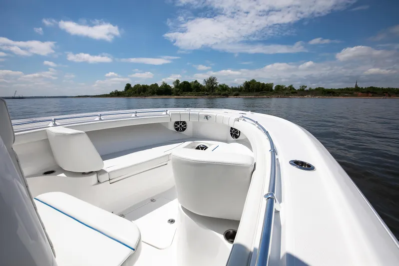  Yacht Photos Pics 2025 Buddy Davis 28 Center Console boat on calm water under blue sky.