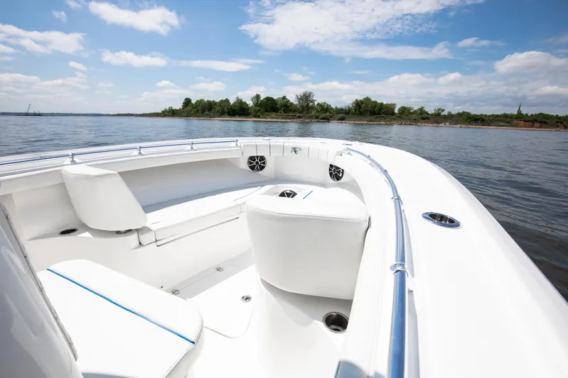  Yacht Photos Pics 2025 Buddy Davis 28 Center Console boat on calm water, clear sky.