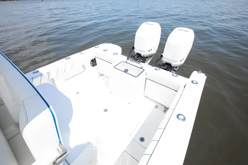  Yacht Photos Pics 2025 Buddy Davis 28 Center Console boat with dual outboard engines on calm water.