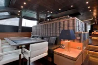 Luxurious interior of 2011 AB 140 yacht with modern dining area and ambient lighting.