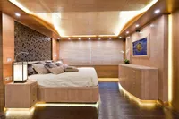 Luxurious bedroom with modern wooden decor, ambient lighting, and elegant furnishings, AB 140 yacht, 2011.