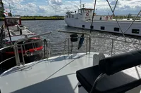Boats docked on a sunny day, view from Custom Belter 1240, 2002 model.