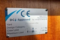 CE approval plate for Custom Belter 1240, 2002, detailing crew and load limits.