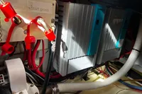 Electrical system with red cables and components, Custom Belter 1240, 2002 model.