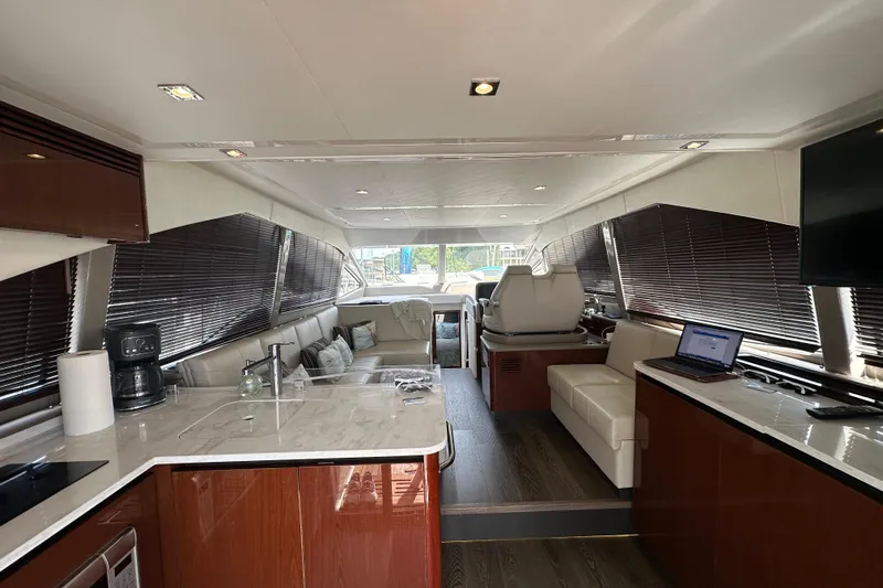  Yacht Photos Pics Luxurious interior of 2017 Sea Ray Fly 460 yacht with modern amenities and elegant design.