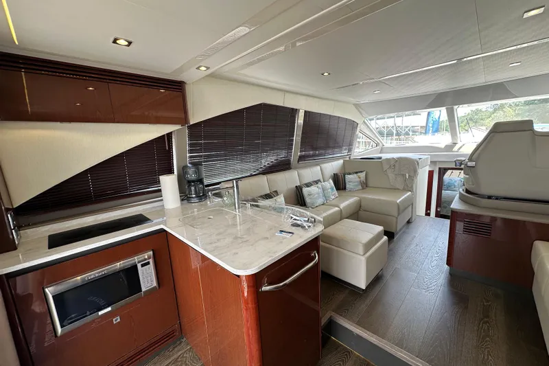  Yacht Photos Pics Luxurious interior of 2017 Sea Ray Fly 460 yacht with modern kitchen and seating area.