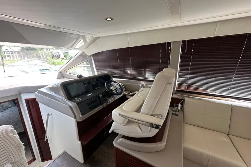  Yacht Photos Pics Luxurious interior of 2017 Sea Ray Fly 460 yacht with modern helm and seating.