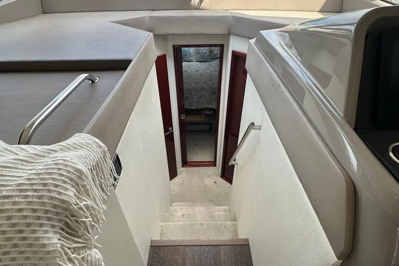  Yacht Photos Pics Interior view of 2017 Sea Ray Fly 460 yacht, featuring stairs leading to a cabin.