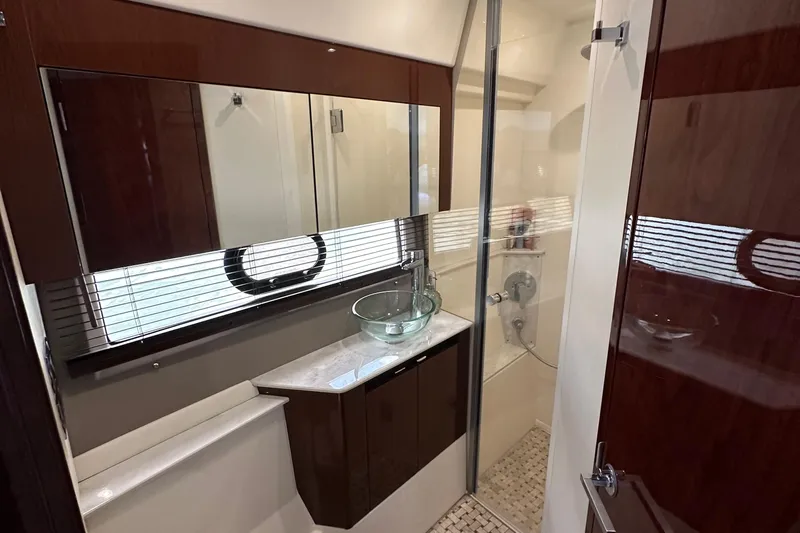  Yacht Photos Pics Luxurious bathroom in 2017 Sea Ray Fly 460 yacht with glass sink and shower.
