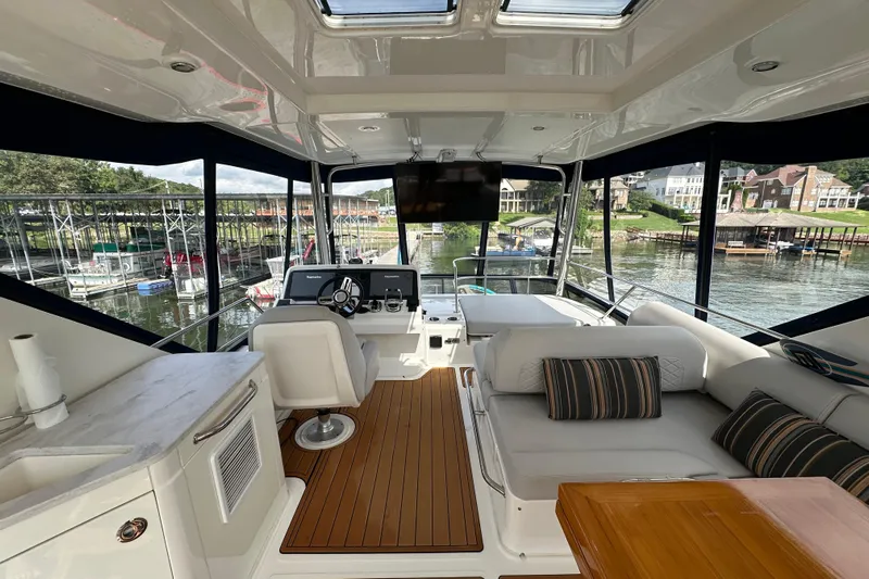  Yacht Photos Pics Luxurious 2017 Sea Ray Fly 460 yacht interior with elegant seating and scenic marina view.