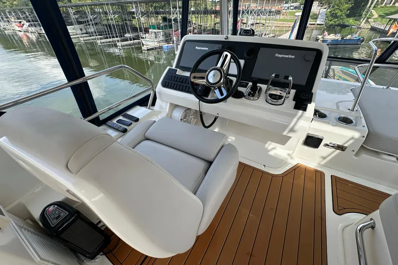  Yacht Photos Pics 2017 Sea Ray Fly 460 helm with modern controls and wood flooring.