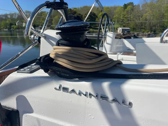  Yacht Photos Pics 2024 Jeanneau Sun Odyssey 380 sailboat deck with winch and coiled rope.