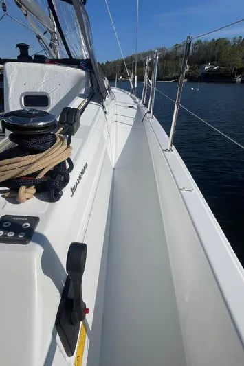  Yacht Photos Pics 2024 Jeanneau Sun Odyssey 380 sailboat deck, featuring sleek design and modern equipment.