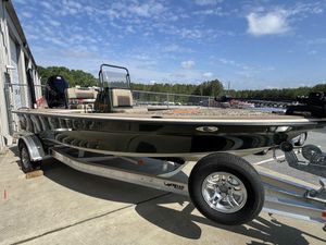 2025 Mako Pro Skiff 18 Backwater Edition on trailer, parked outdoors under blue sky.
