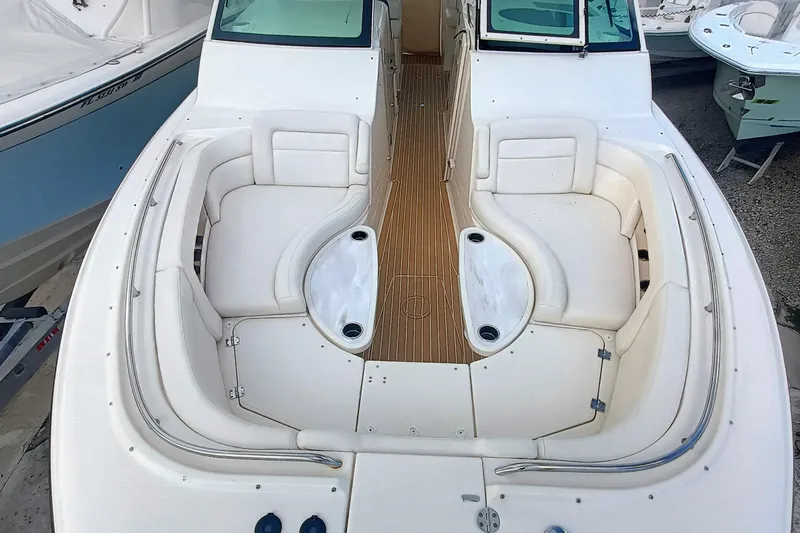 375-712 Used Yacht Photos Pics 2021 Grady-White Freedom 375 boat interior with white seating and wooden flooring.