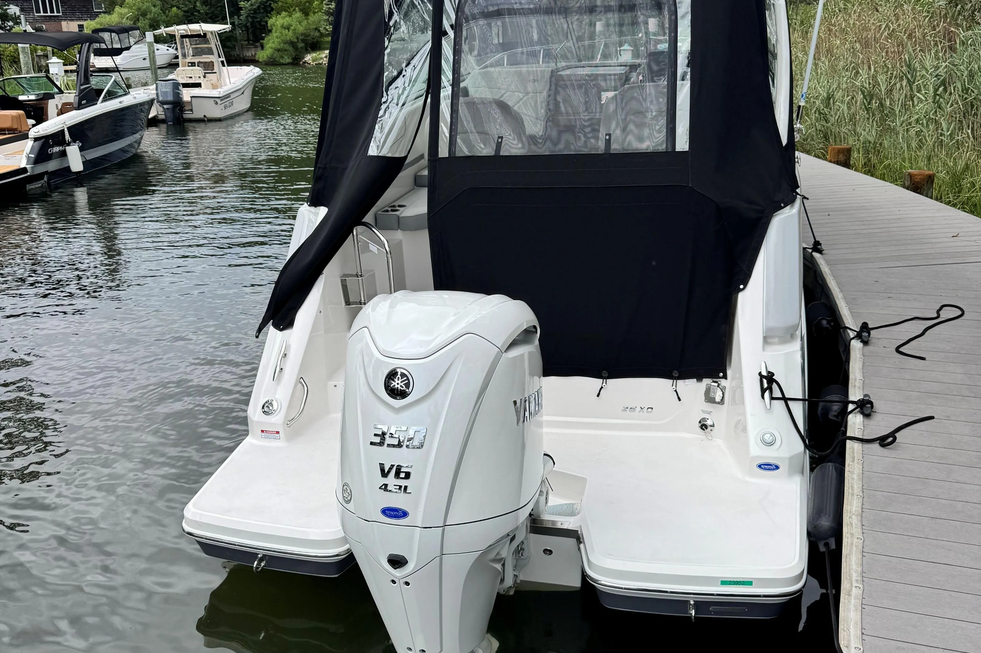2026 Regal 26 XO boat with Yamaha V6 engine docked at marina.
