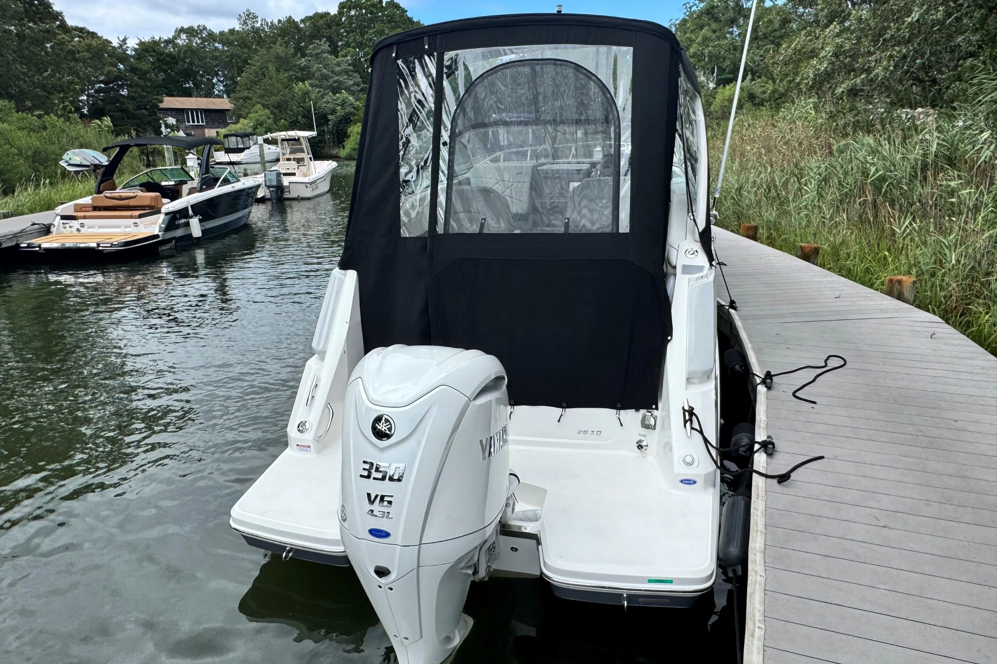 2026 Regal 26 XO boat docked, featuring a Yamaha 350 V6 outboard engine.