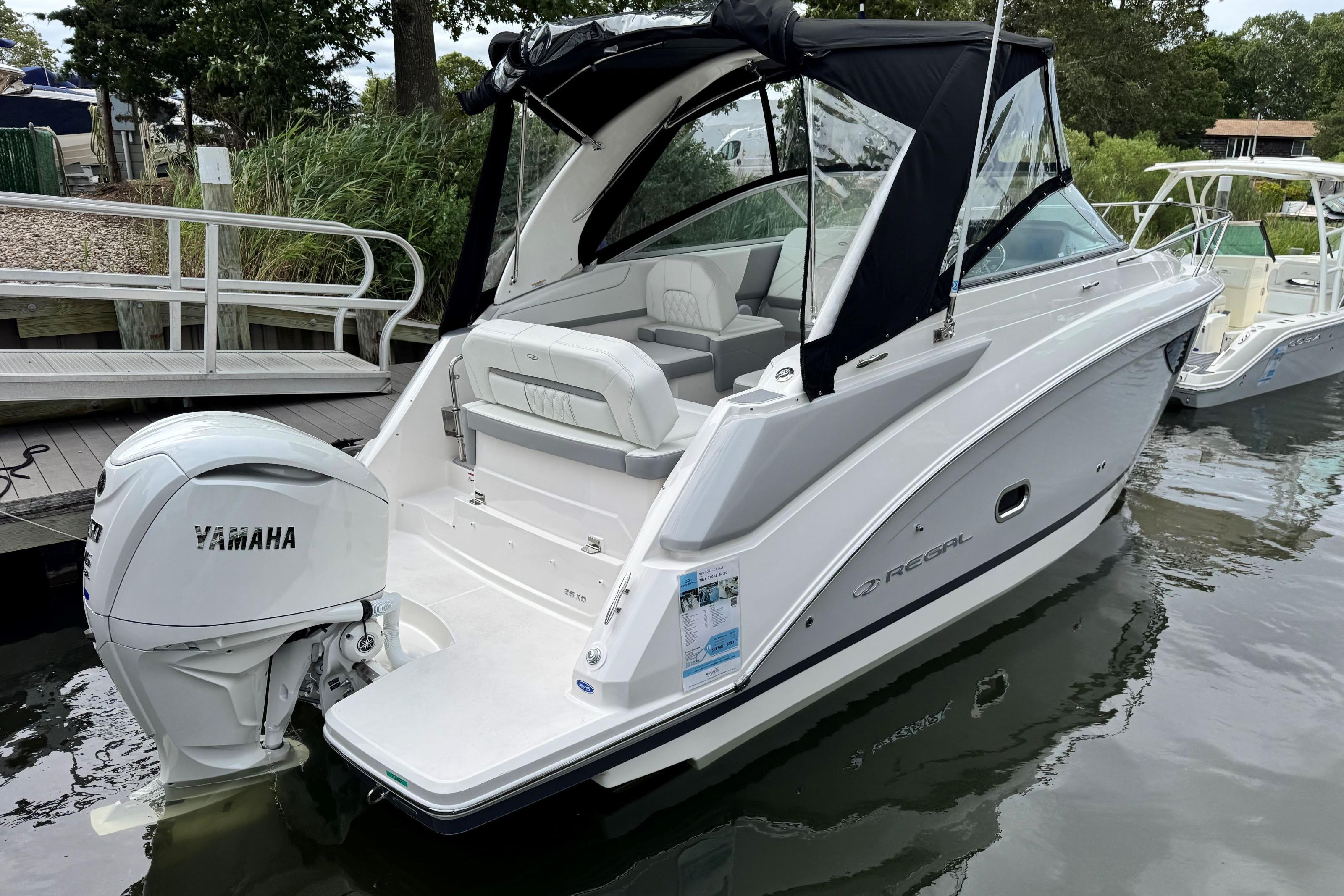 2026 Regal 26 XO boat with Yamaha outboard engine docked in a marina.