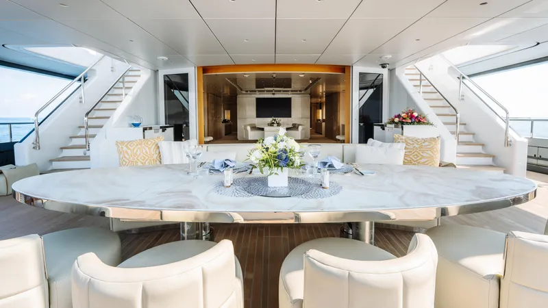 Loon Yacht Photos Pics Luxurious dining area on 2010 Icon Full Displacement Motoryacht with elegant table setting.
