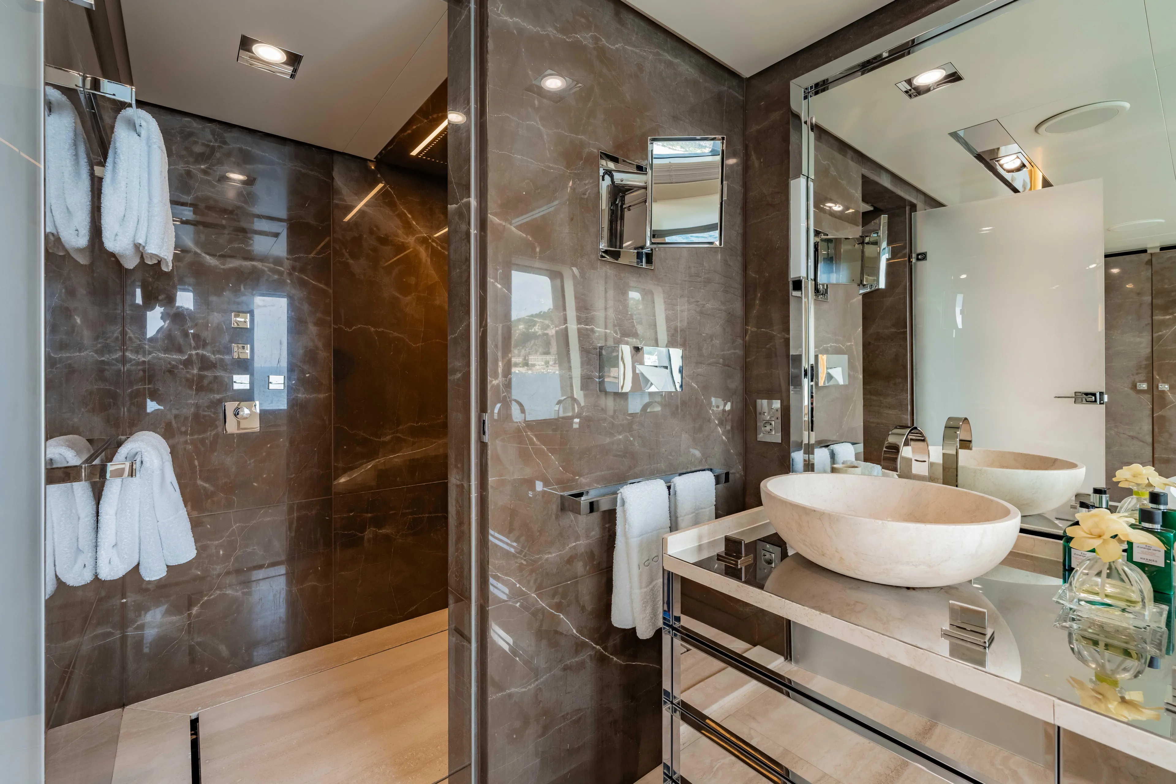 Loon Yacht Photos Pics Luxurious bathroom on a 2010 Icon Full Displacement Motoryacht with marble walls and modern fixtures.