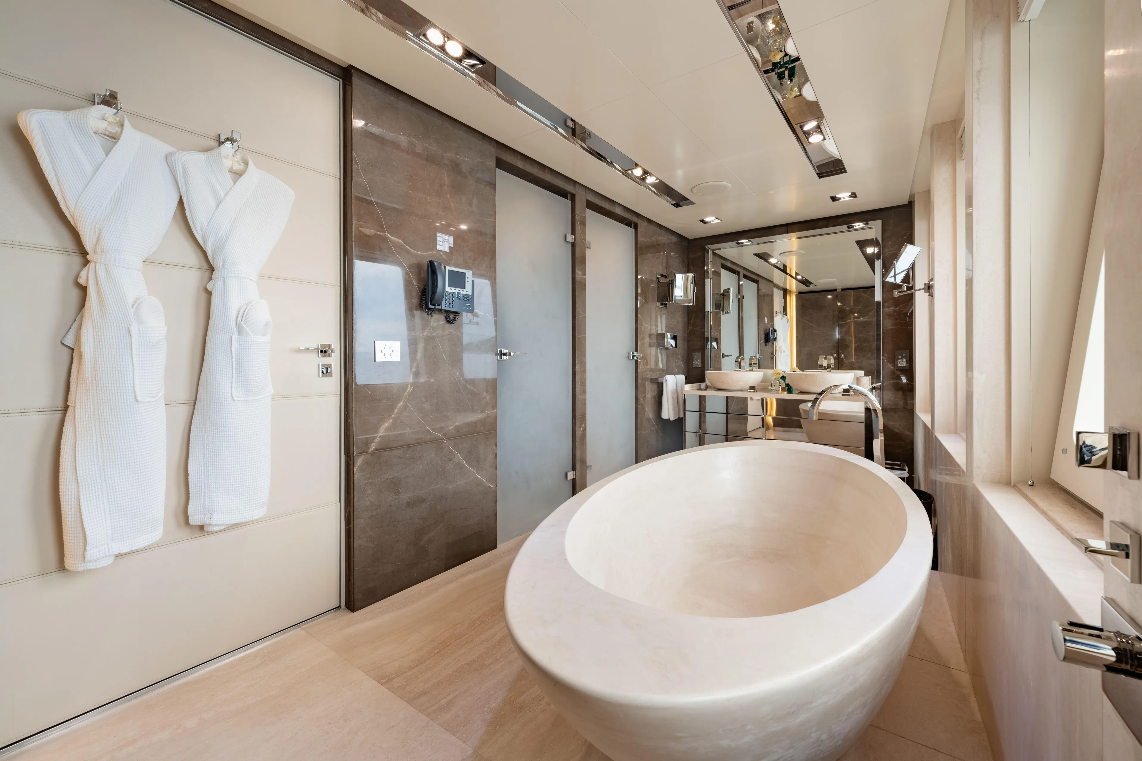 Loon Yacht Photos Pics Luxurious bathroom on a 2010 Icon Full Displacement Motoryacht with modern fixtures and a freestanding tub.