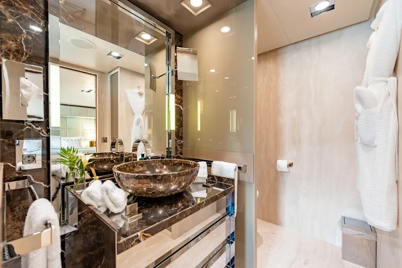 Loon Yacht Photos Pics Luxurious bathroom on a 2010 Icon Full Displacement Motoryacht with marble sink and modern fixtures.