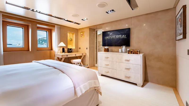 Loon Yacht Photos Pics Luxurious bedroom on a 2010 Icon Full Displacement Motoryacht with modern decor and large windows.