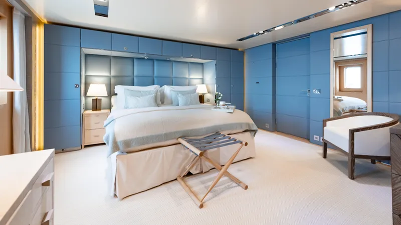 Loon Yacht Photos Pics Luxurious bedroom on a 2010 Icon Full Displacement Motoryacht with modern blue decor.