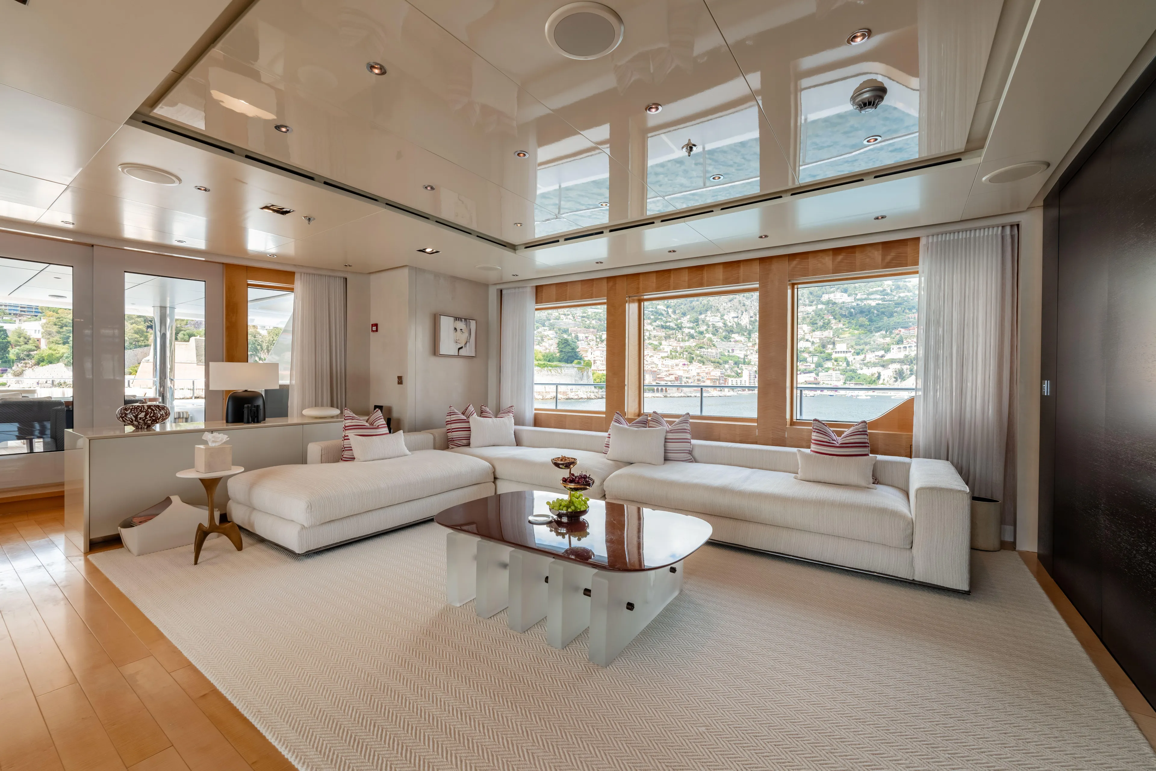 Loon Yacht Photos Pics Luxurious interior of 2010 Icon Full Displacement Motoryacht with large windows and modern furnishings.