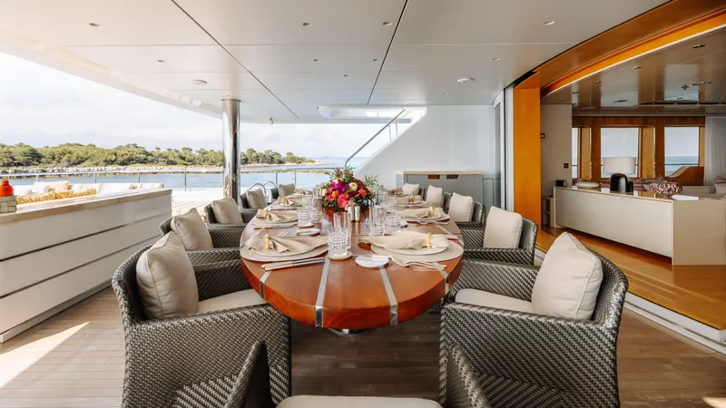 Loon Yacht Photos Pics Luxurious dining area on 2010 Icon Full Displacement Motoryacht with elegant table setting.