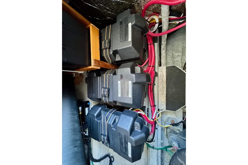 Tui Yacht Photos Pics Battery compartment of a 2005 Back Cove 29 boat with wiring and protective covers.