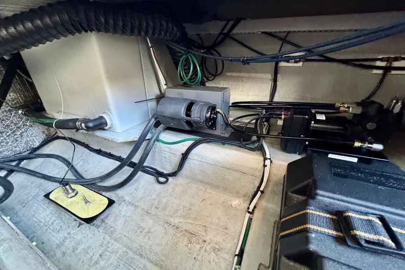 Tui Yacht Photos Pics 2005 Back Cove 29 engine compartment with wiring and mechanical components.