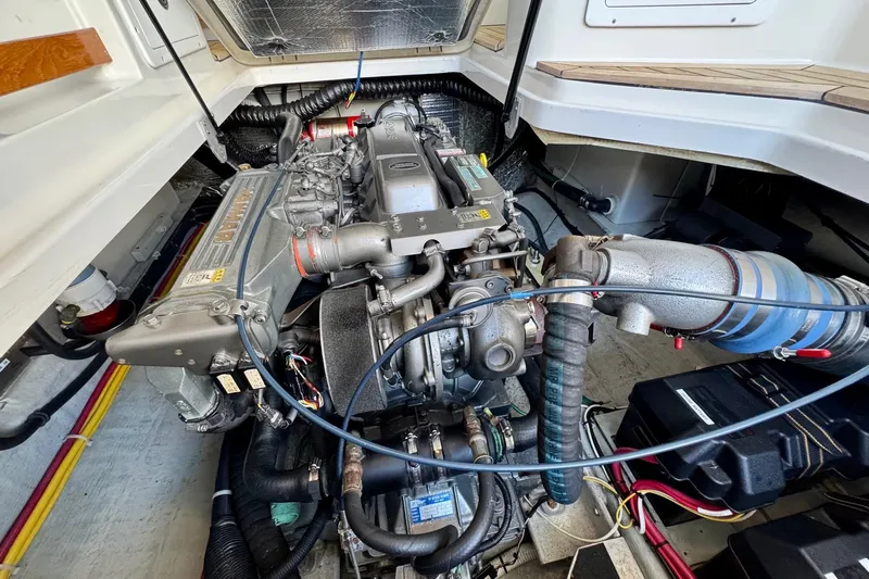 Tui Yacht Photos Pics Engine compartment of a 2005 Back Cove 29 boat, showcasing detailed mechanical components.