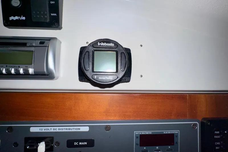 Tui Yacht Photos Pics Control panel of a 2005 Back Cove 29 boat featuring Webasto SmarTemp thermostat.