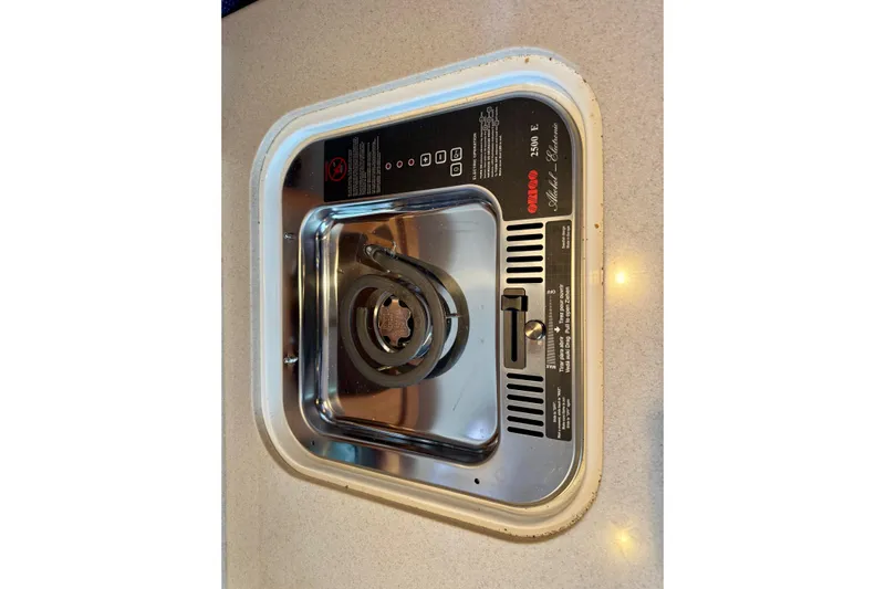 Tui Yacht Photos Pics Built-in stove on 2005 Back Cove 29 boat, featuring a single electric burner.