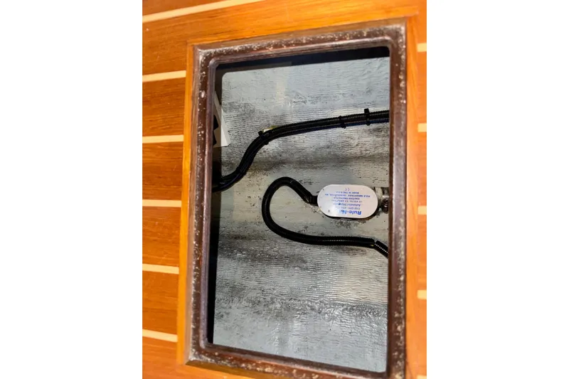 Tui Yacht Photos Pics Bilge compartment of 2005 Back Cove 29 boat with visible wiring.