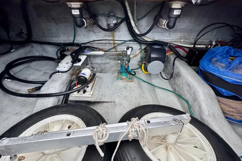 Tui Yacht Photos Pics Engine compartment of a 2005 Back Cove 29 boat, showing mechanical components and wiring.