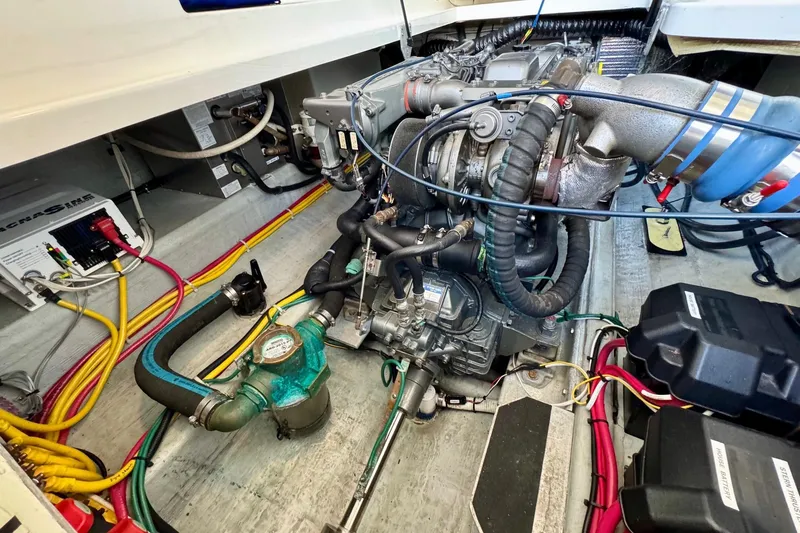 Tui Yacht Photos Pics Engine compartment of a 2005 Back Cove 29 boat, showcasing detailed wiring and components.