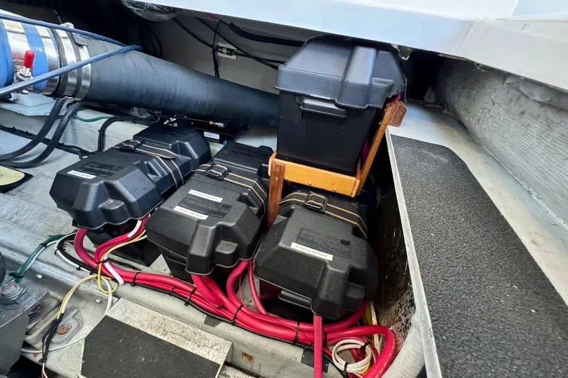 Tui Yacht Photos Pics Battery compartment of a 2005 Back Cove 29 boat with wiring and secure enclosures.